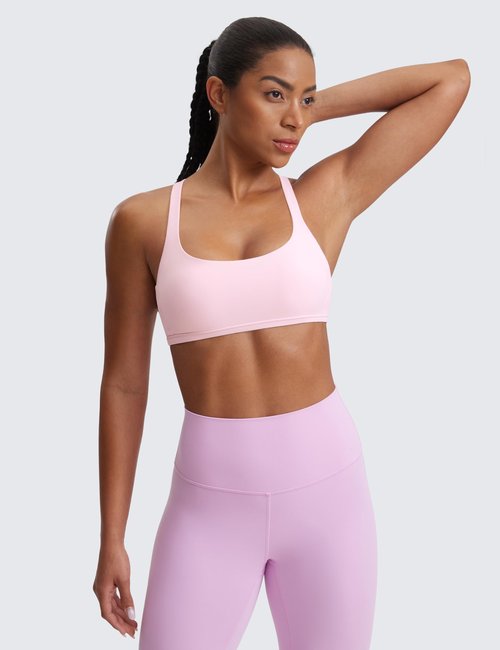 CRZ YOGA Naked Feeling Cross Back Sports Bras for Women - Strappy Back Padded Medium Support Wireless Gym Cami Workout Yoga Strawberry Pink Small