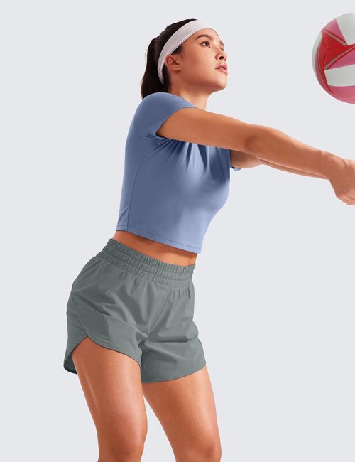 CRZ YOGA Dolphin Athletic Shorts - Mid-Waisted Quick-Dry Running Shorts with Zip Pocket for Women