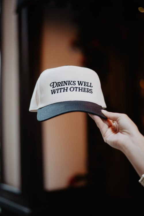 KATYDID Drinks Well with Others Vintage Hat - Two-Toned Trucker Hat - Embroidered Vintage Baseball Cap for Women - Snapback (Black/Tan)