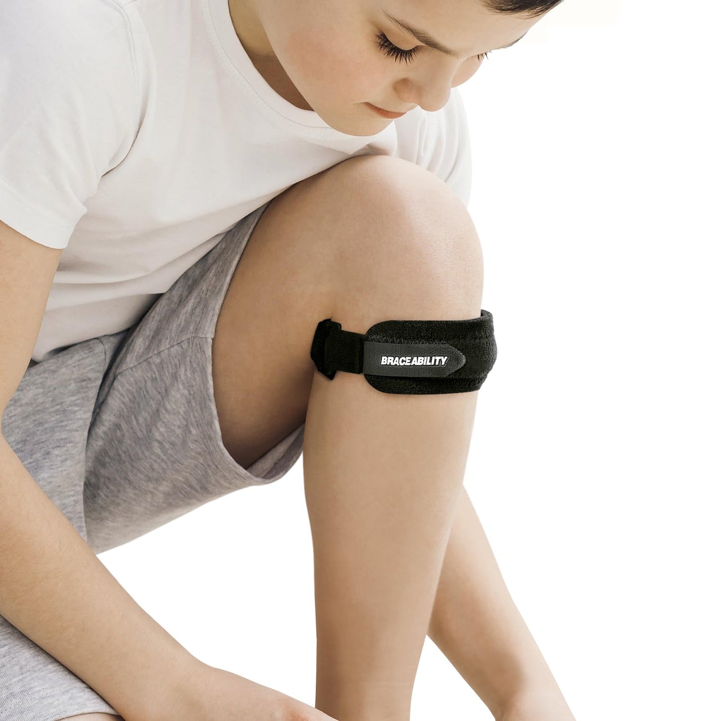 BraceAbility Kids Knee Band - Youth Patellar Tendon Support Strap Child Osgood Schlatter Brace for Jumpers Knee, Patella Tendonitis, Sports Wrap for Running, Soccer, Volleyball, Basketball (S)