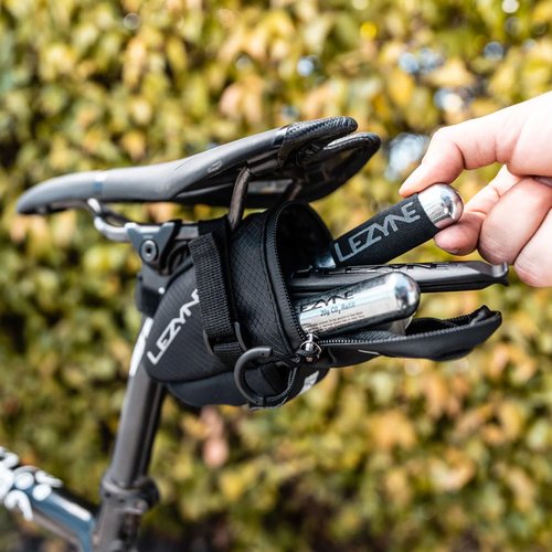 LEZYNE Caddy Bike Saddle Bag - Durable Nylon Cycling Storage Bag with Velcro/Quick Release Mount, Reflective Accents, Water-Resistant Zipper for Road Bikes & Commuters, Medium