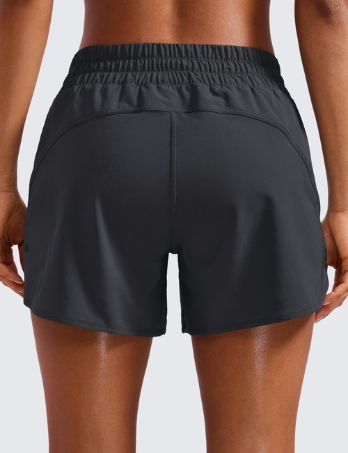 CRZ YOGA Dolphin Athletic Shorts for Women 5" - High Waisted Quick Dry for Running Workout Gym Track with Zip Pocket Graphite Grey Medium