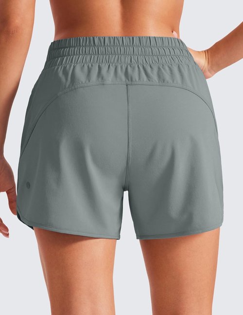 CRZ YOGA Dolphin Athletic Shorts - Mid-Waisted Quick-Dry Running Shorts with Zip Pocket for Women
