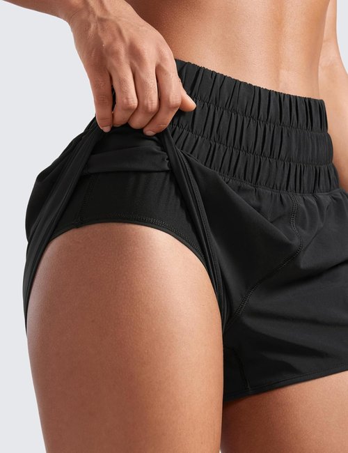 CRZ YOGA High Waisted Dolphin Running Shorts - Women's Athletic Gym Shorts with Mesh Liner & Zipper Pocket