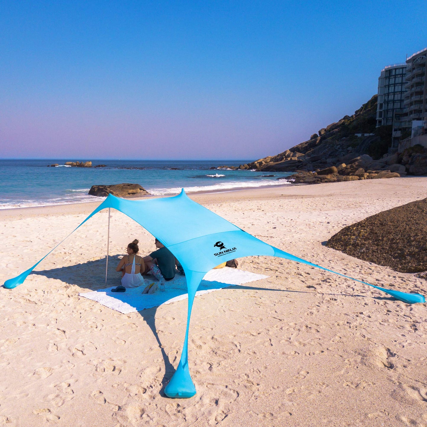 SUN NINJA Pop Up Beach Tent Sun Shelter UPF50+ with Sand Shovel, Ground Pegs and Stability Poles, Outdoor Shade for Camping Trips, Fishing, Backyard Fun or Picnics (7x7.5 FT 2 Pole, Turquoise)